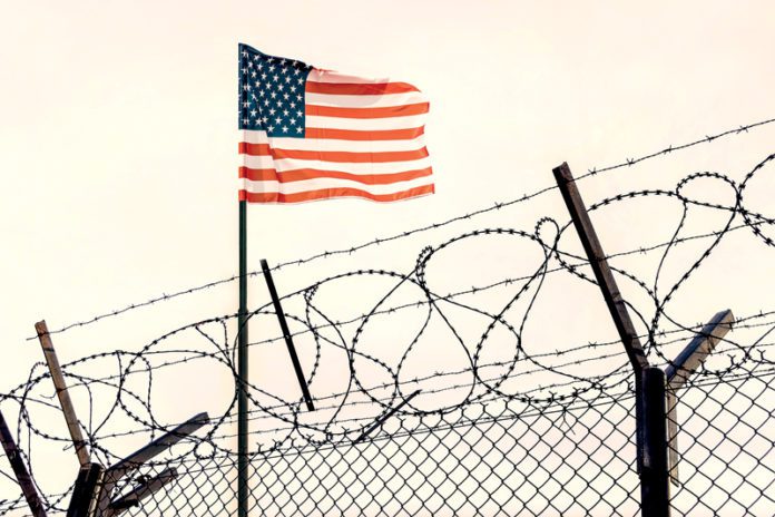 mexican border. Concept of United States of America closed borders with flag and wire fence. USA immigration and homeland security. American dream concept, not accessible and hard to reach.
