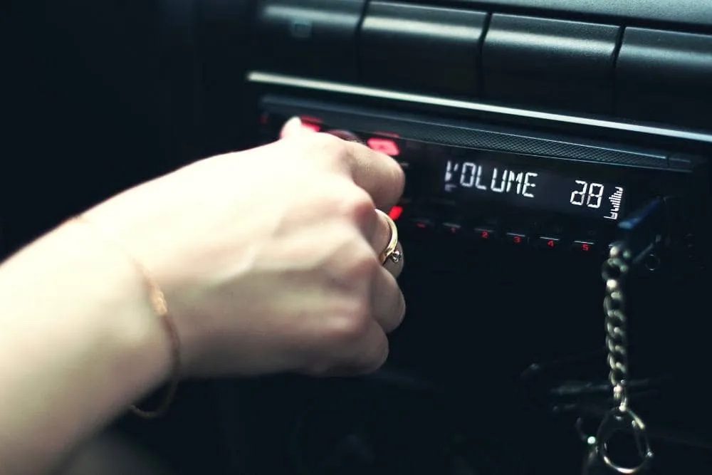 hand adjusting volume