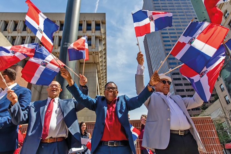 August 16, 2022 - Mayor Michelle Wu participates in raising the Dominican Republic flag in City Hall Plaza. (Mayor’s Office Photo by Mike Mejia)