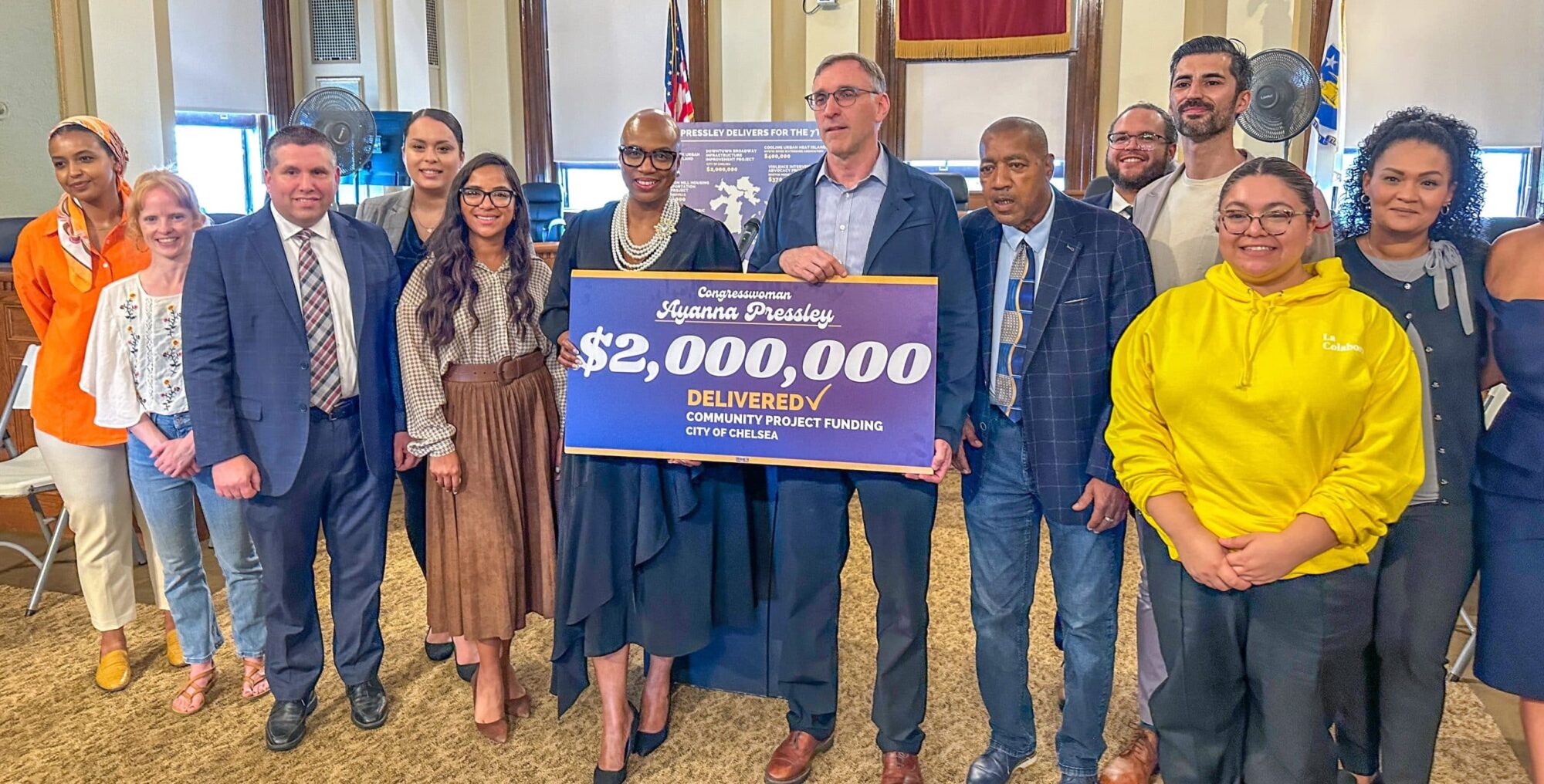 > U.S. Representative Ayanna Pressley delivers the check and celebrates the funding amount that has not been seen in Chelsea since the 1970's
