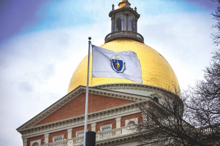 The Massachusetts State House and Flag.