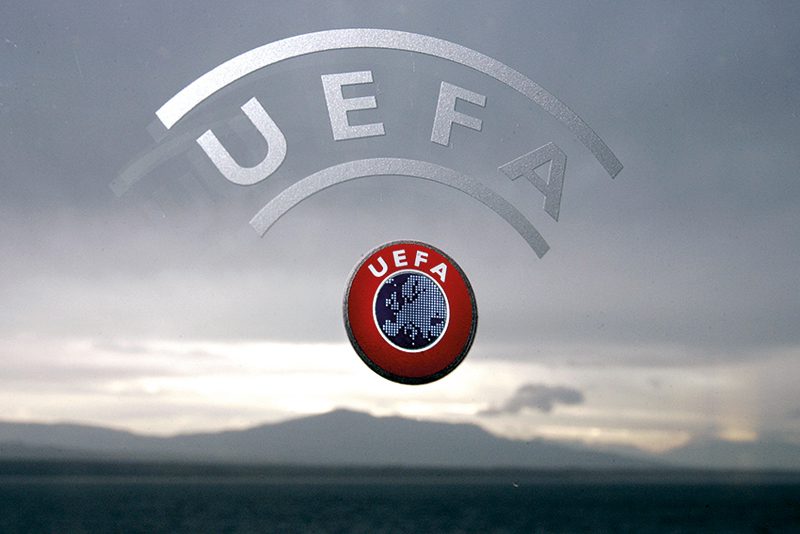 Nyon, SWITZERLAND:  A UEFA logo is seen with Geneva Lake and Alps as background 08 December 2006 during a press conference closing a two days Executive committee meeting of the European football federation at the headquarters in Nyon. AFP PHOTO / FABRICE COFFRINI  