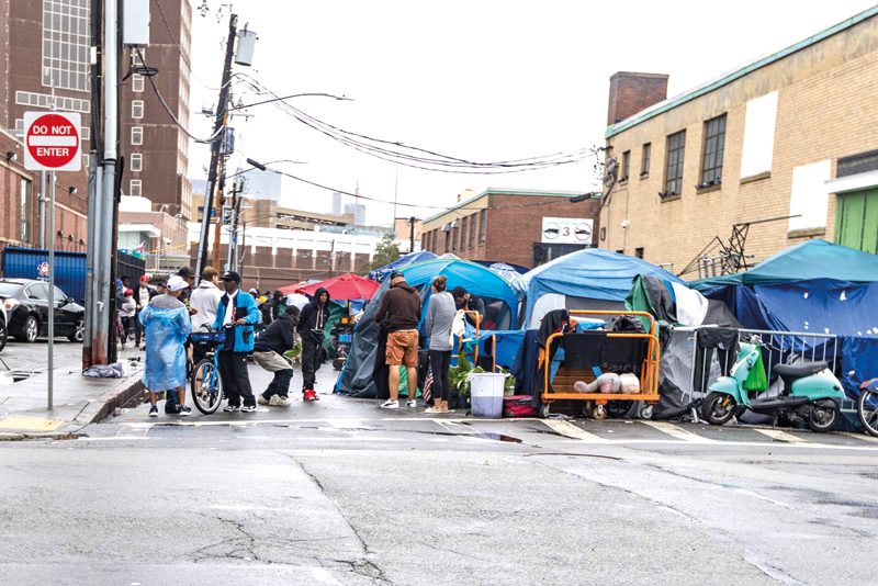 Homeless people living in tents on Atkinson Street in the Mass and Cass area. (