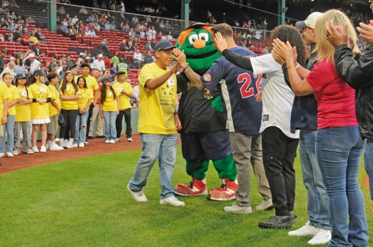Viva Revere and Lynn!: El Mundo Boston and the Red Sox honored Latino middle school students from Revere and Lynn during the third of three Latino Youth Recognition Days this year. In the photo Eric Daniel Mayorga Aguirre from the Susan B. Anthony Middel School in Revere is congratulated by Red Sox mascot Wally and Revere Mayor Patrick Keefe. Sox players Aroldis Chapman, Jorge Alcala, David Hamilton and Sox manager Alex Cora also participated.