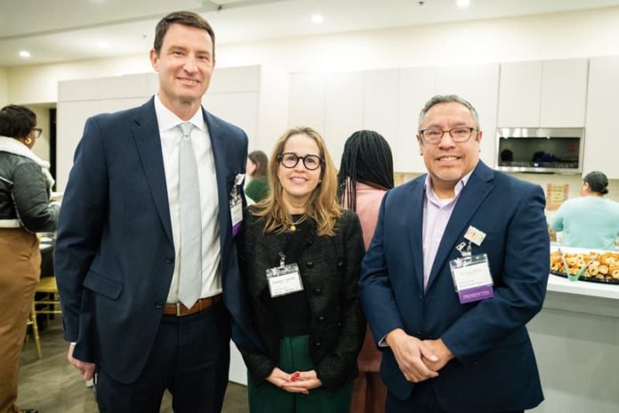 (From left to right) NeighborHealth leadership team members Jamie Hazard, CEO and President; Eugenia Coronado, Vice President Specialty Services and Patient Experience; Dr. Julio Mazul, Executive Vice President and Chief Medical Officer meet during a conference break.