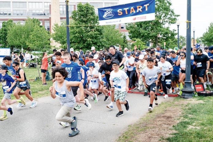More than 900 runners and walkers begin to cross the starting line at Let’s Get Movin’ 5K for Fitness bang at East Boston’s Memorial Park on Saturday, June 6.
