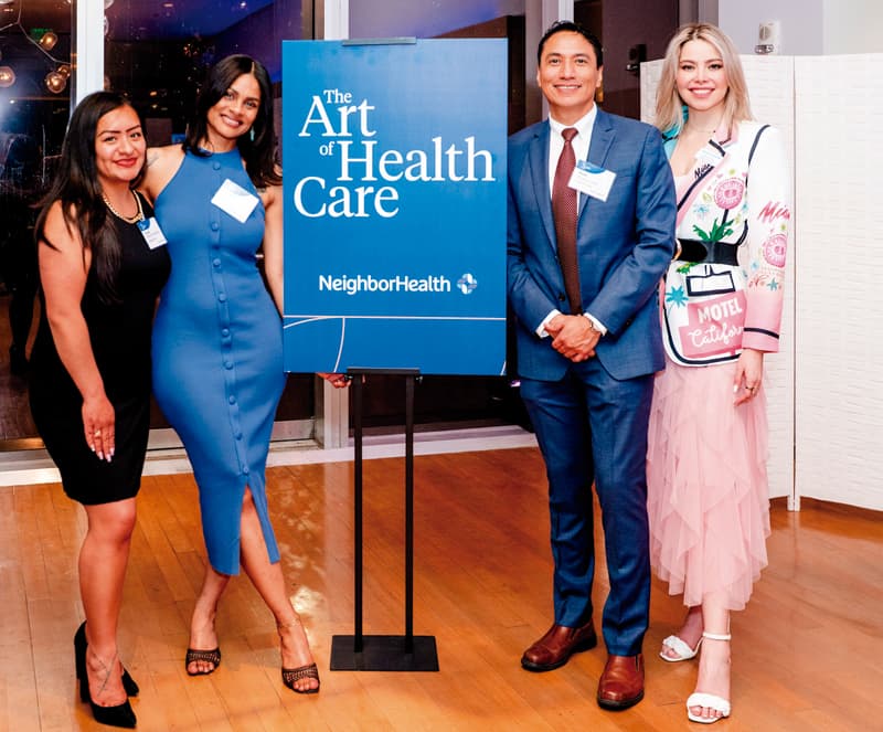 From left to right) NeighborHealth Operations Manager Wendy Olivares Herrera; Adult Medicine Medical Director Dr. Juan Huanuco, and Communications & Marketing Manager Susana Elman pose with artist and donor Rosalia Peña of East Boston, second from left.