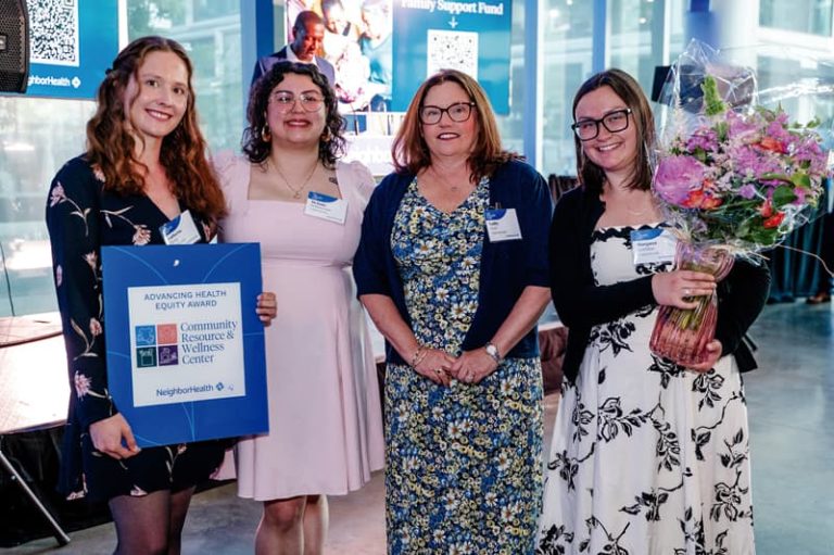 (From left to right) Catharine Hemp, Melanie Bethancourt Fajardo, Kathy Field and Margaret Keithline of the Community Resource and Wellness Center pose with the Advancing Health Equity Award.